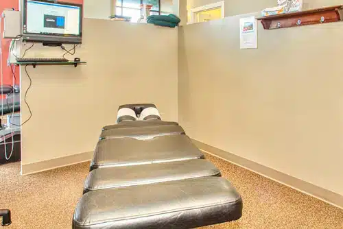 Private chiropractic adjustment room with treatment table at Vital Mill Creek Chiropractic
