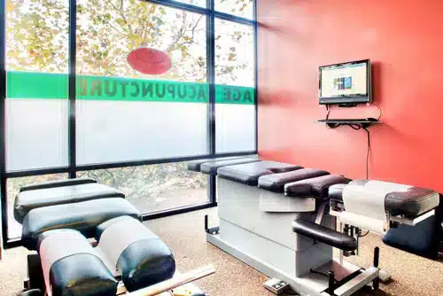 Chiropractic treatment room with adjustment tables at Vital Mill Creek Chiropractic clinic